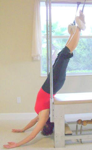 Hanging exercise on the Pilates Cadillac