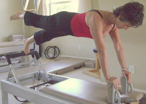 pilates front pushup on the reformer apparatus